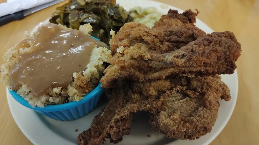 Fried Chicken and Fried Pork Chop with Dressing and Gravy Lima Beans and Collards